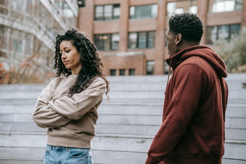 Person experiencing rejection while sitting alone in a quiet setting, reflecting sadness and emotional pain associated with rejection and social exclusion.